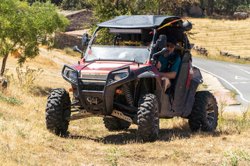 Adventurous retiree exploring the countryside in a 4x4 utv buggy quad
