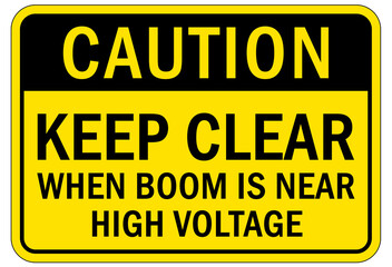 Obraz premium Overhead crane hazard sign and labels keep clear when boom is near high voltage