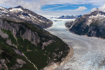 Aerial view of the Norris Glacier, as it makes its way down out of the mountains near Juneau, Alaska. 