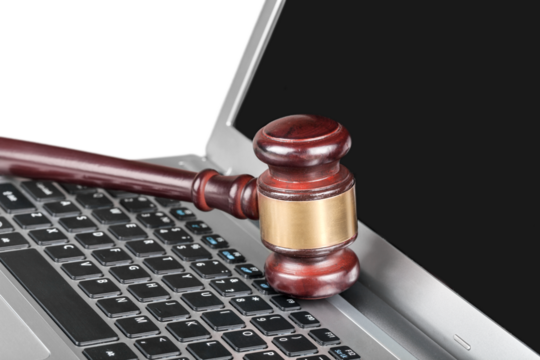 Gavel and laptop - Concept of technology and the law