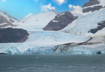 Landscape of a glacier on the mountain in Patagonia with a lot of ice and green lake