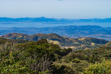 view from the hills above Monteverde Cloud Forest towards the Pacific Ocean in Costa Rica
