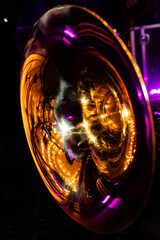 Closeup of French horn in concert lights