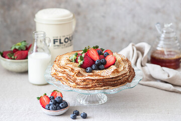 Sweet french and russian style homemade pancake crepes with berries.
