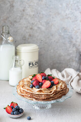 Sweet french and russian style homemade pancake crepes with berries.