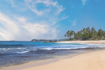 Beautiful view of the tropical beach of Sri Lanka on a sunny day