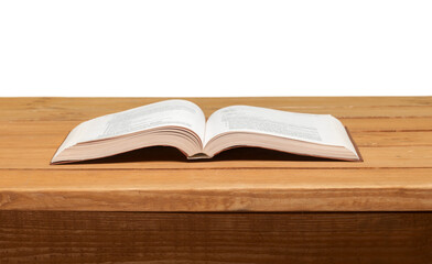 Open book on wood table over grunge background