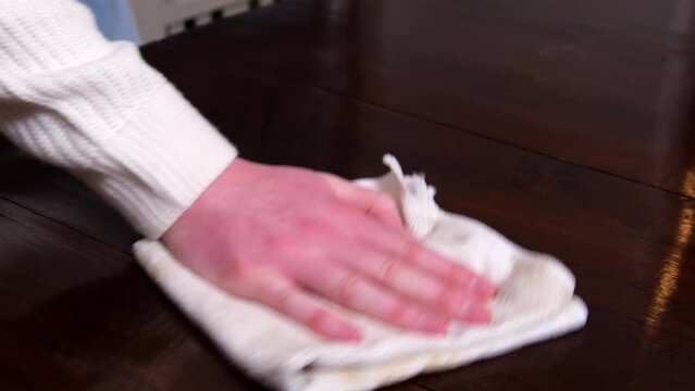 Polishing a table close up