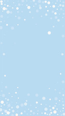 Snowfall overlay christmas background. Subtle flying snow flakes and stars on light blue winter backdrop. Festive snowfall overlay. Vertical vector illustration.