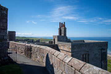 Bamburgh Castle walls looking out towards sea and coast. Northumberland, UK