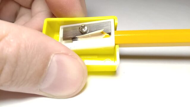 pencil sharpening macro. pencil sharpener and shavings close-up view