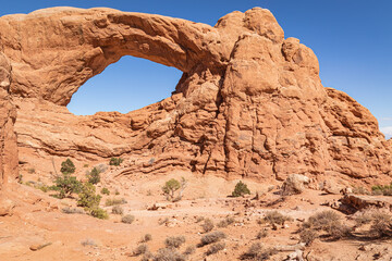 Natural sandstone arch formation in the arid desert of Arches National Park, Utah.
