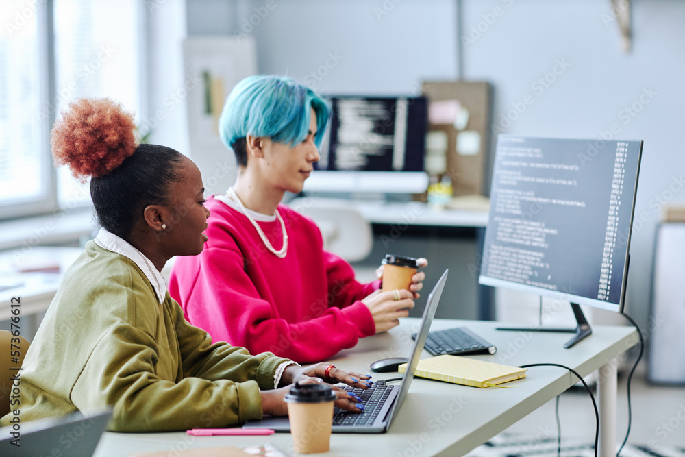 Wall mural gen z creative team working on software programming in office, side view