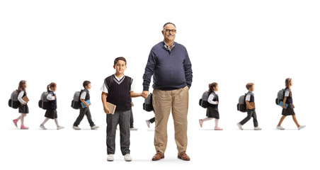 Obraz premium School drop off, grandfather taking grandson to school and schoolchildren walking behind