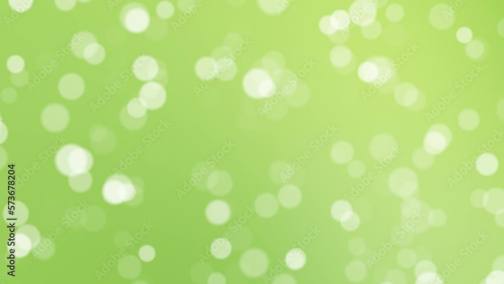 Poster abstract blurred dots flying towards the camera on sunny green nature blurred bokeh background. copy