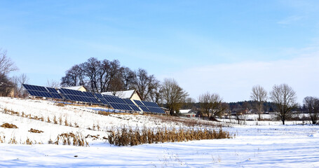 Fototapeta na wymiar Solar cells Photoelectric cells on a bright, sunny, frosty winter day in the countryside. Solar batteries are an alternative energy.