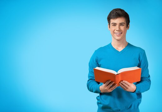 smart young man student reading book