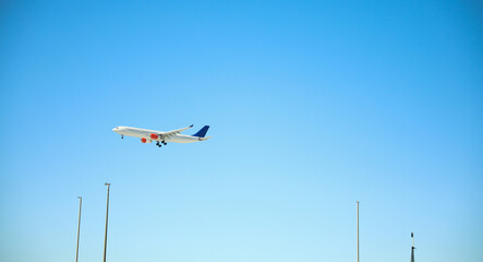 airplane in the blue sky for travel in the clouds and sun 