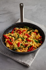 Homemade Scrambled Peppers and Eggs in a Pan, side view.