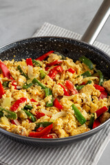 Homemade Scrambled Peppers and Eggs in a Pan, side view.