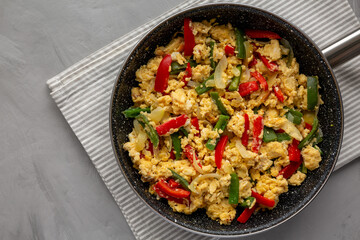 Homemade Scrambled Peppers and Eggs in a Pan, top view. Flat lay, overhead, from above. Copy space.