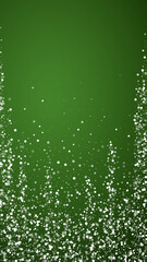 Snowy christmas background. Subtle flying snow flakes and stars on christmas green background. Delicate sweet snowy christmas. Vertical vector illustration.