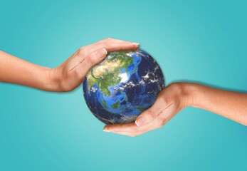 Concept of Earth Day. Hands hold a Globe.