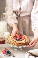 Sweet french and russian style homemade pancake crepes with berries.