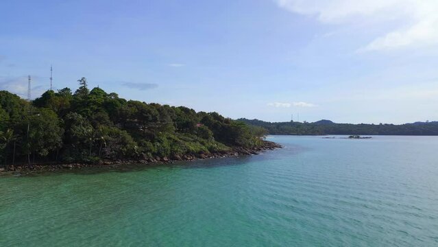 turquoise water headland rocky beach hilly island. Nice aerial view flight drone