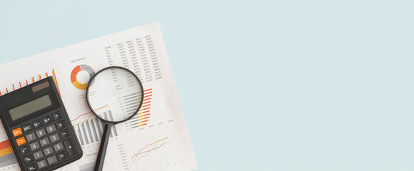 Business graphs, charts and magnifying glass on table. Financial development, Banking Account, Statistics