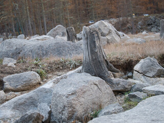 The dry bottom of the Ceresole Reale lake in autumn. Alps, Italy.