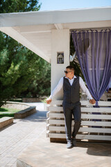 portrait of the groom of a man in the morning before the wedding