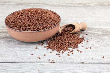 Raw buckwheat on wood