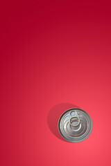 Cover page with a modern metal can with an opener and shadow at gradient rosy background with copy space