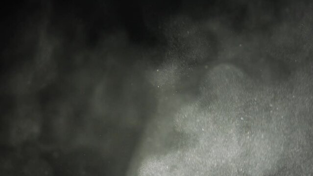 Whirling clouds of dust particles fly up