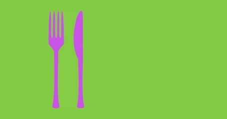 Composition of purple knife and fork and copy space on green background