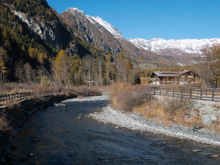 Brusson lake in autumn. Ayas valley, Italy.