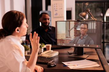 Colleagues talking on corporate online meeting using videocall app on computer, employees discussing business plan on videoconference. Project manager speaking on teleconference briefing