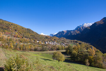 Fototapeta na wymiar Around Brusson lake in autumn. Ayas valley, Italy.