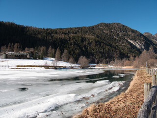 Around Brusson lake in winter. Ayas valley, Italy