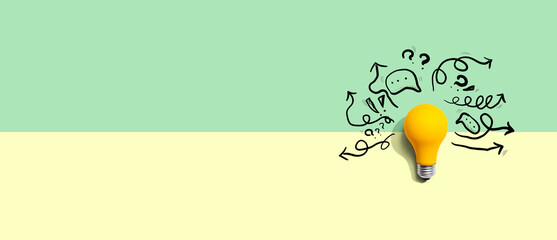 Brainstorming concept with a light bulb - Flat lay © Tierney