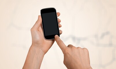 Hand holds a phone with phone with a blank screen