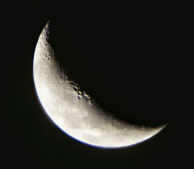 a beautiful moonlit night with clear skies and a spectacular crescent moon.