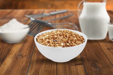 Oat flakes in the bowl. Tasty morning dish