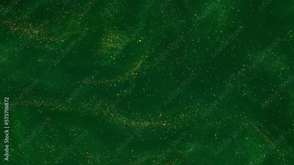 Wall mural wavy movement of flying gold dust particles on a green background. chaotically moving gold shiny dus