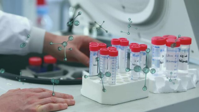 Animation of molecular structures over mid section of scientist keeping sample in centrifuge machine