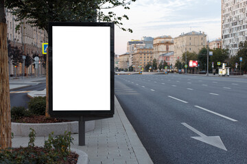 Vertical billboard advertising in the city. Early morning without anyone. Mock-up.