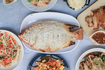 Fish grilled salt. Thai foods style placed. Thai dipping spicy sauce and green vegetables. Low fat and healthy food in Thailand. 