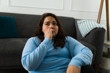 Latin obese woman suffering from anxiety