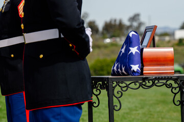 Marines standing at attention next to Veterans Urn
